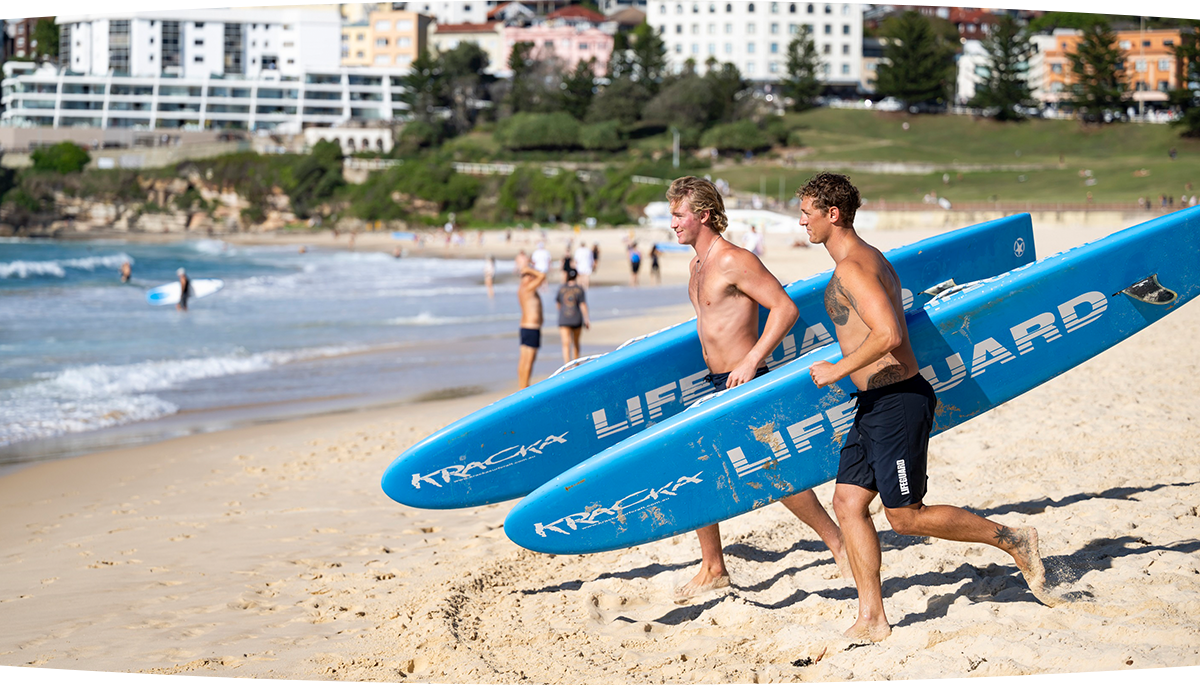 Two life savers running down the beach in Network 10's Bondi Rescue